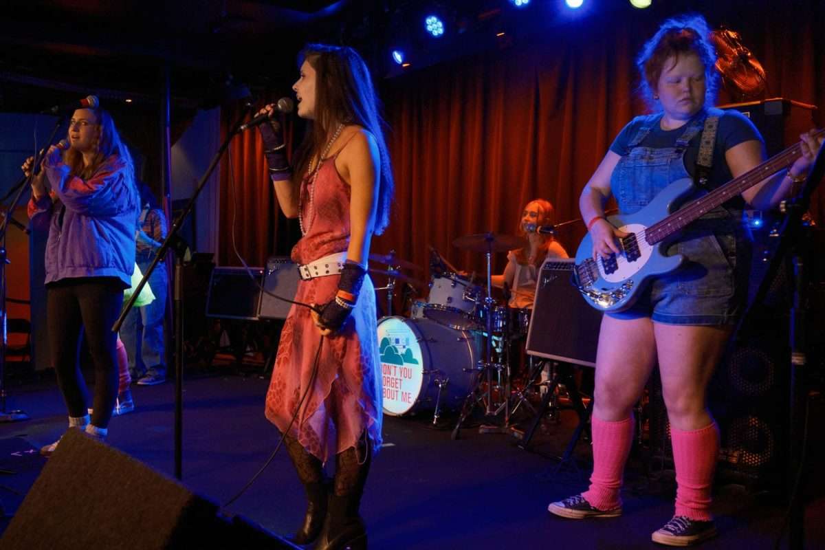 Two singers, bass player, and drummer from Wisteria